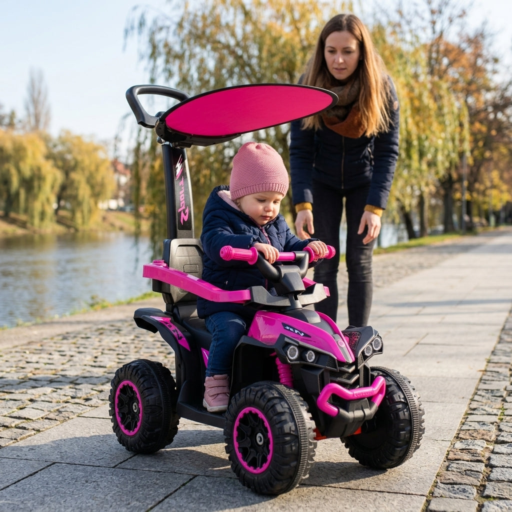 Kvad guralica roze sa tendom i ručkom na popločanom šetalištu pored reke sa detetom koje drži volan